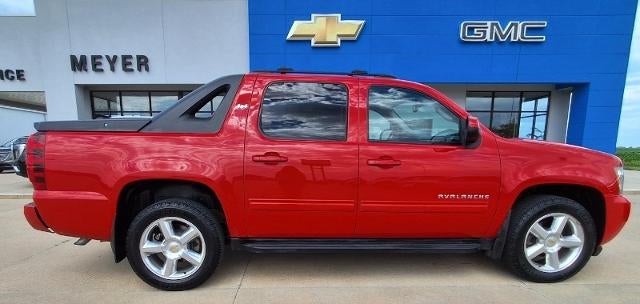 2011 Chevrolet Avalanche LS in Victory Red — front three-quarter view